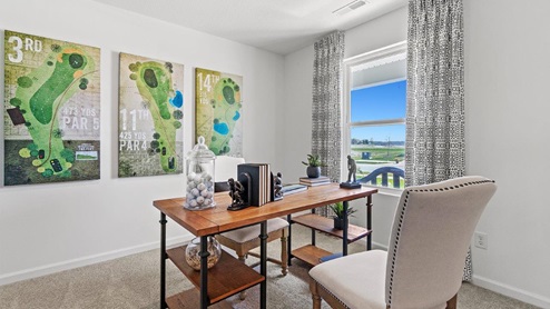 Livingston Lakes Holcombe model home flex room with single window and carpet flooring