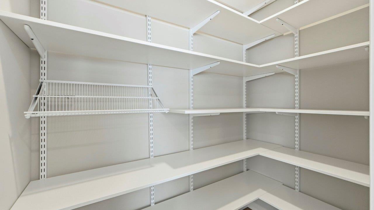 kitchen pantry with built-in freedom rail shelving system