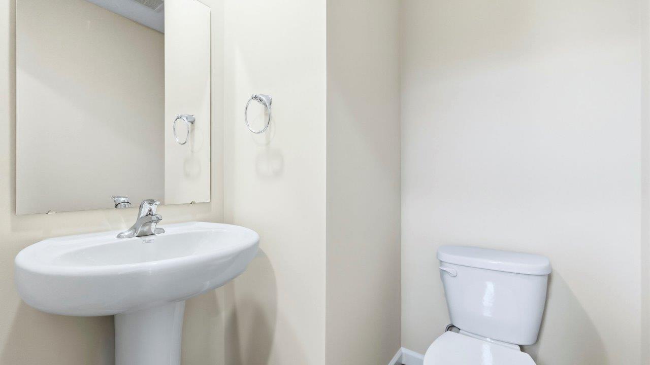 first floor half bathroom with pedestal sink