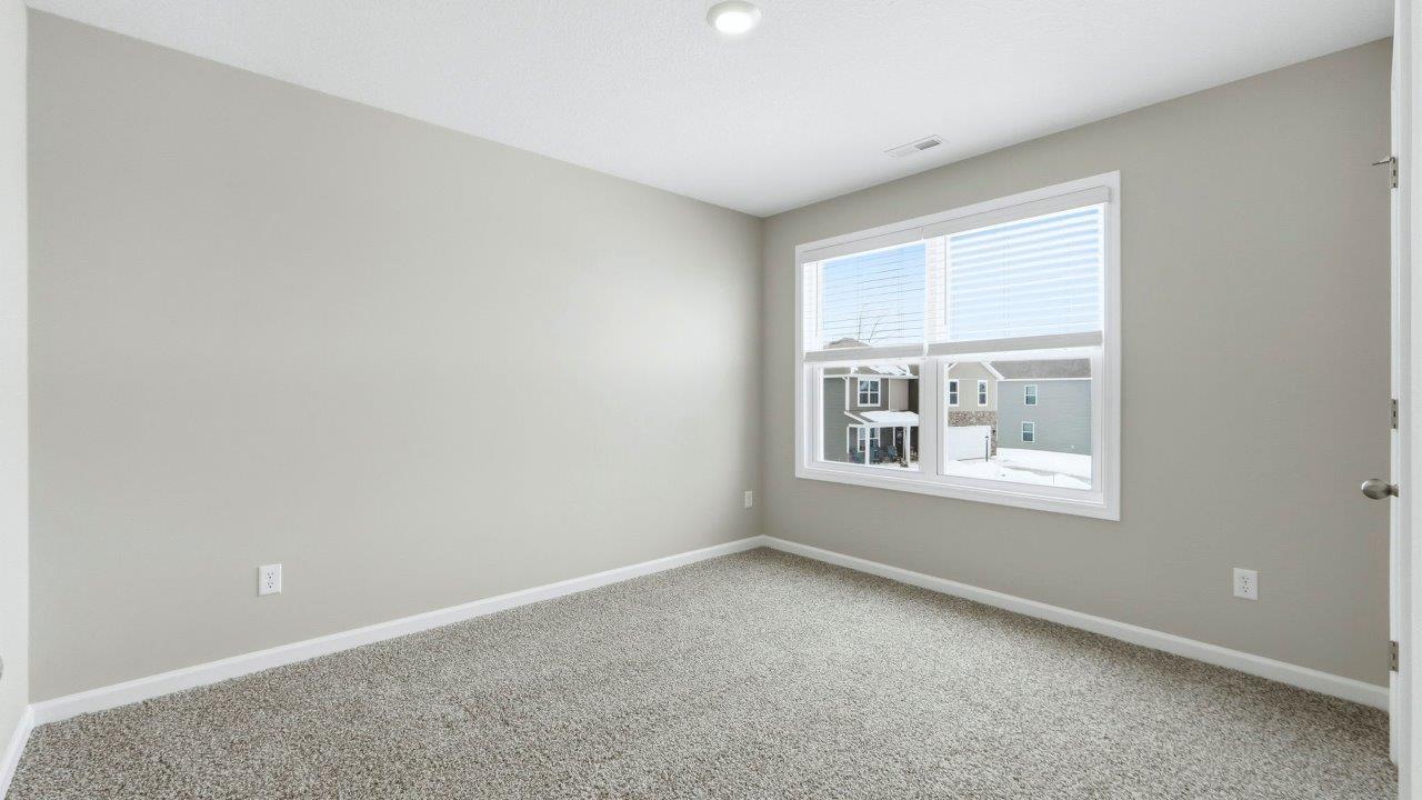 bedroom 4 with elk beige carpet, 2 windows, popular grey walls, and closet