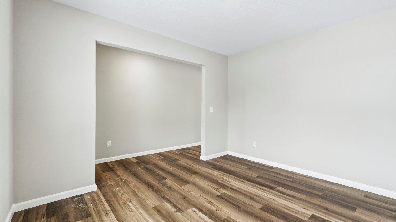 study with mohawk eastmont lvp, popular grey walls, 2 windows, and disc lighting.