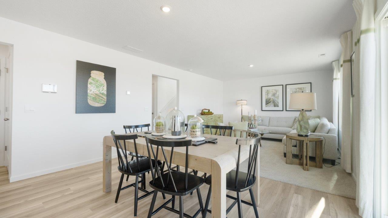 bellamy dining room with lvp flooring and sliding door to backyard