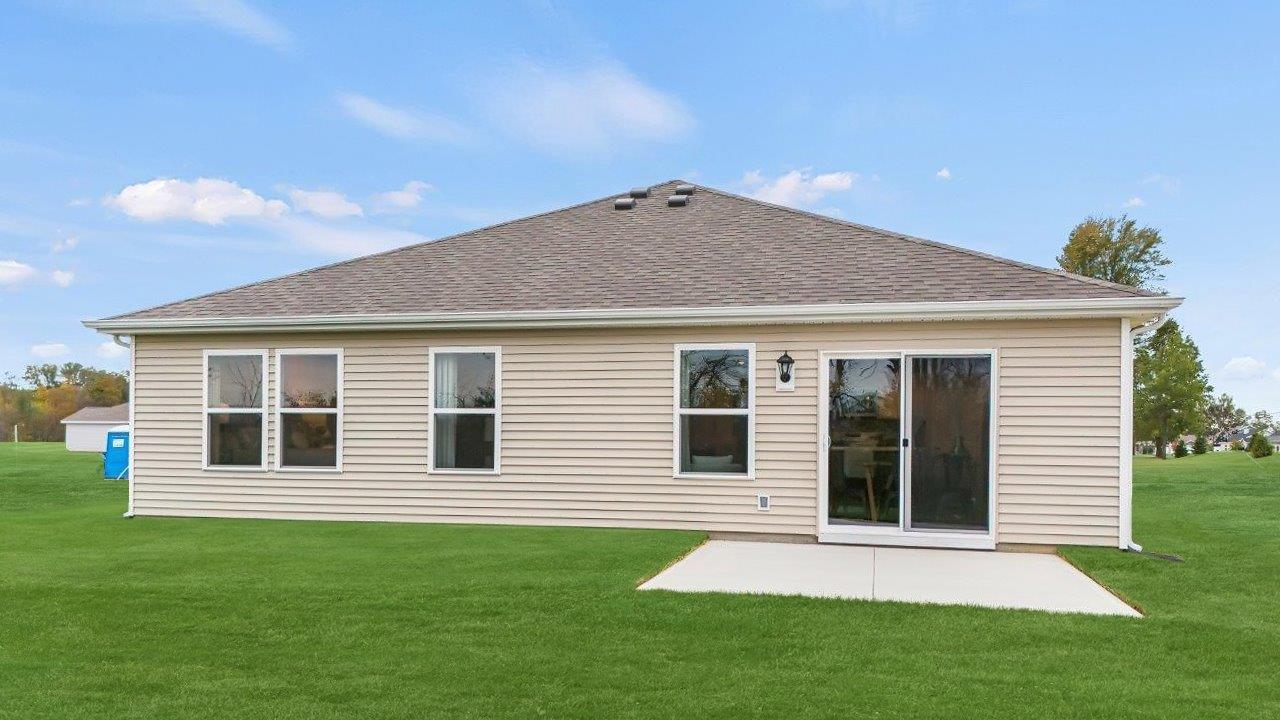 traders trace harmony model home exterior with patio