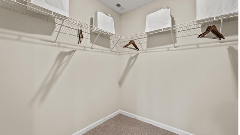 Trader's Trace Harmony Model Home Walk in closet off of main bedroom