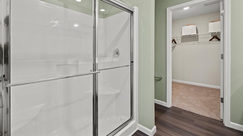 Trader's Trace Harmony Model Home bathroom off of main bedroom with walk in shower