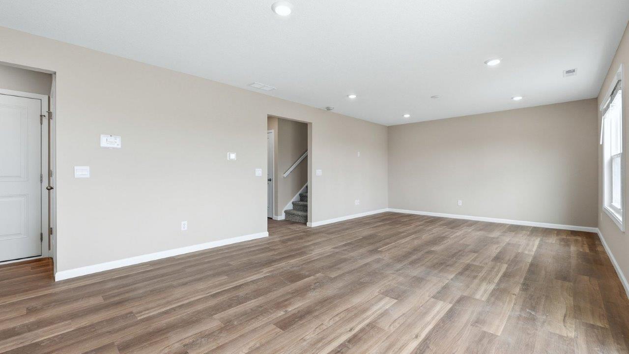 casual dining space with mohawk eastmont lvp flooring and sliding door to backyard patio