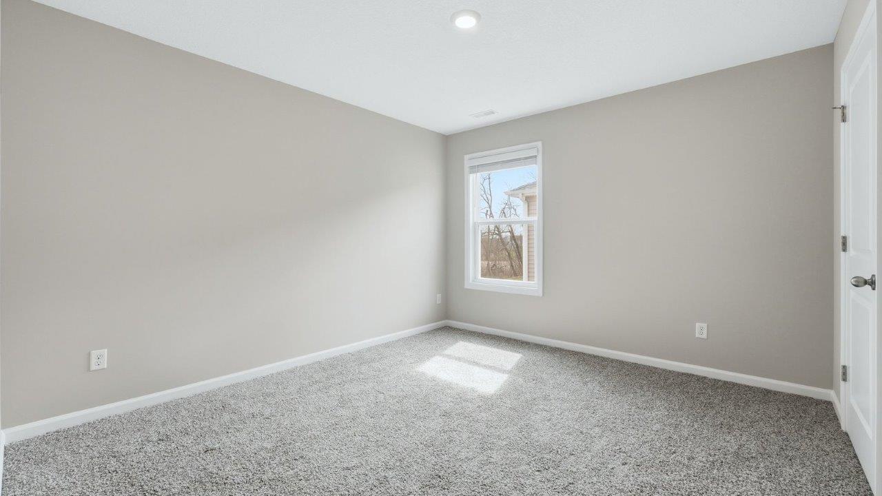 bedroom 3 with beige carpet, 1 windows, closet, and popular grey walls
