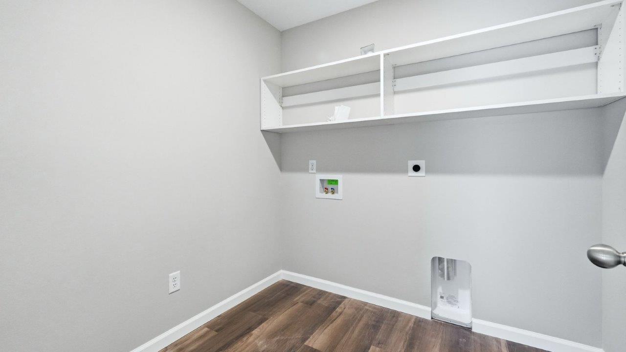 laundry room with built-in shelving
