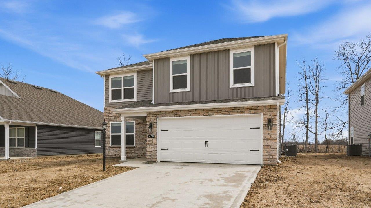 bellamy exterior- covered porch, 2 car garage, harvard slate siding, and colorado stone.