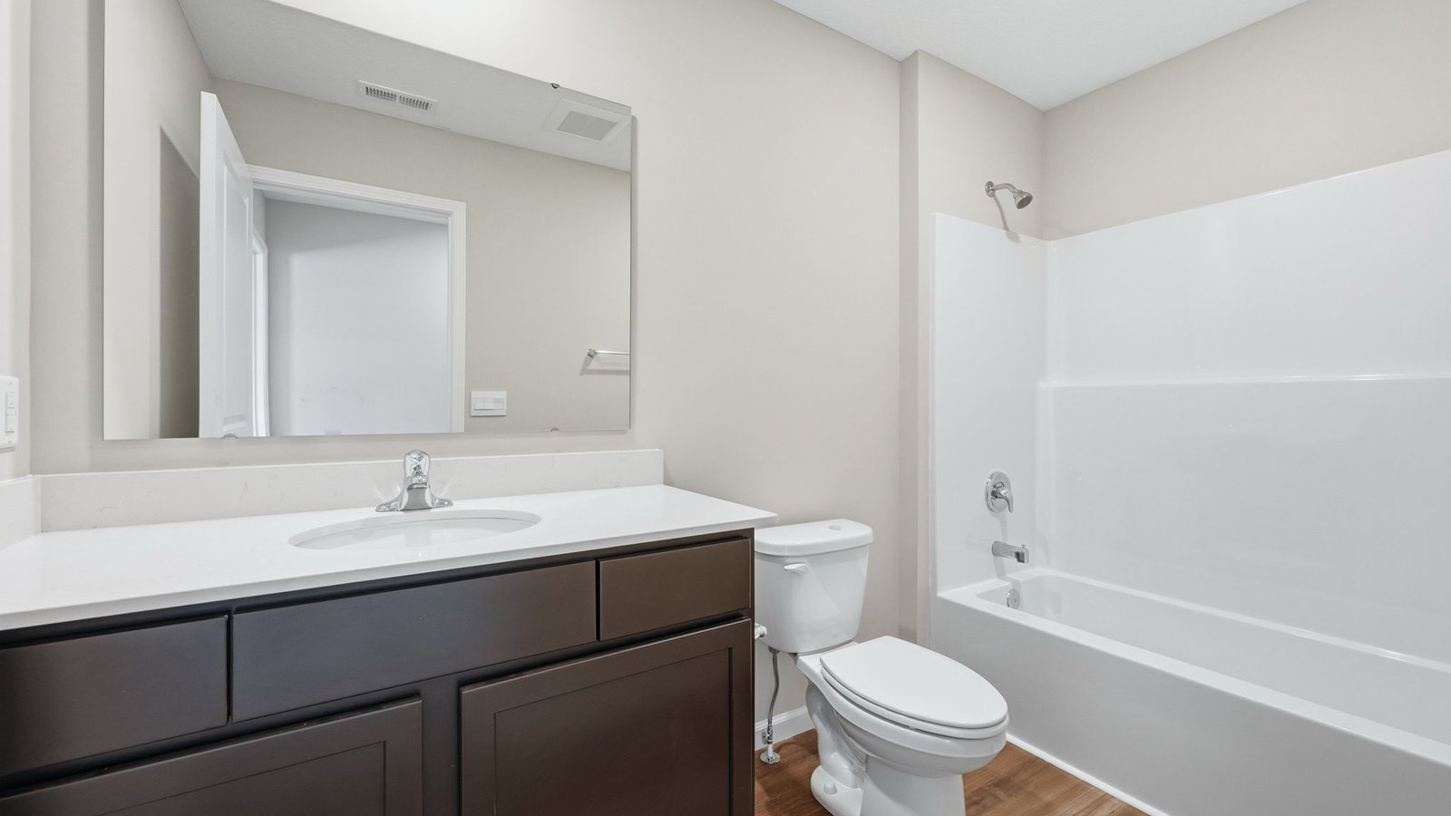 full bath with vanity sink and tub shower
