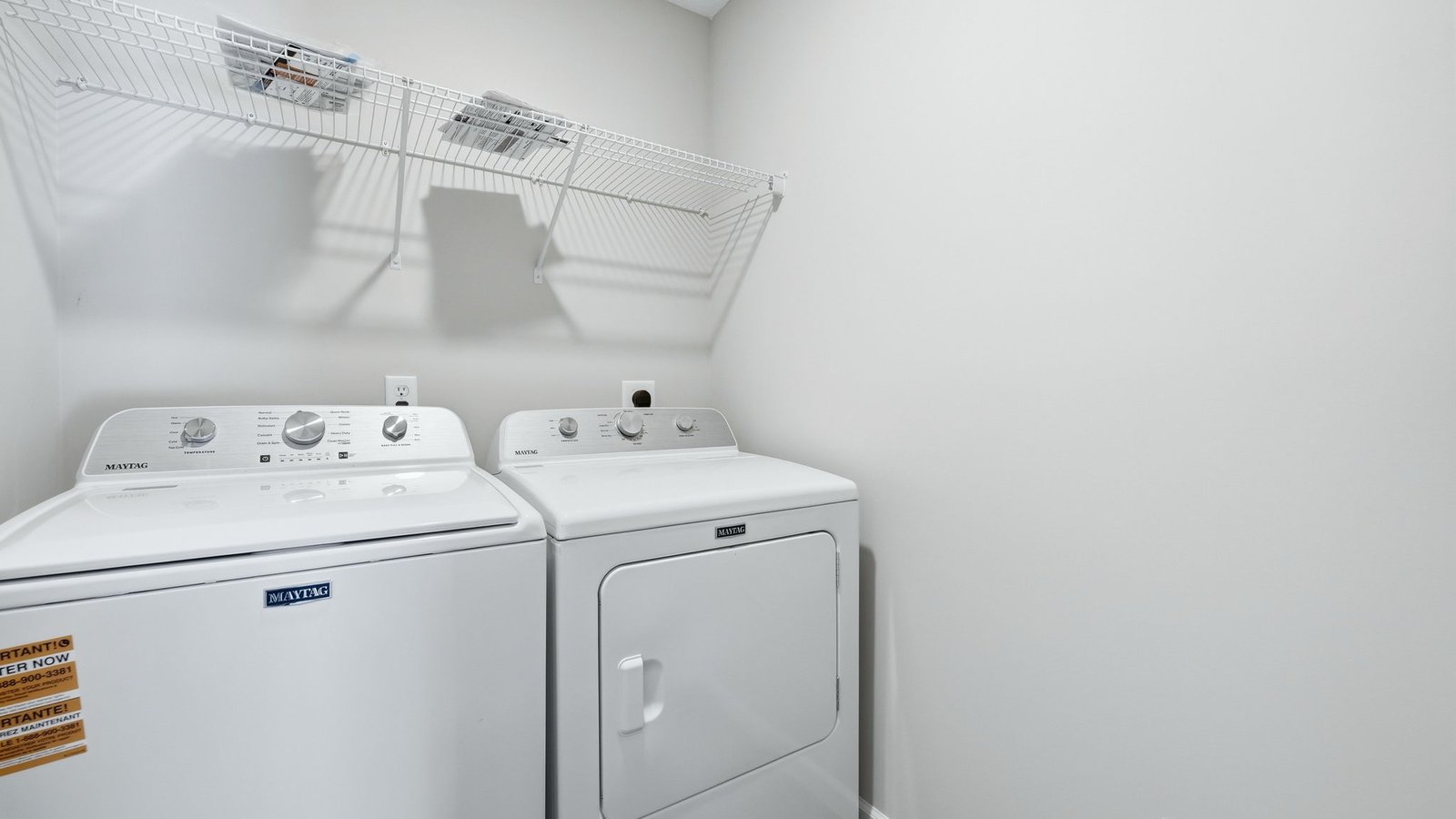 laundry room with washer, dryer, built-in shelving