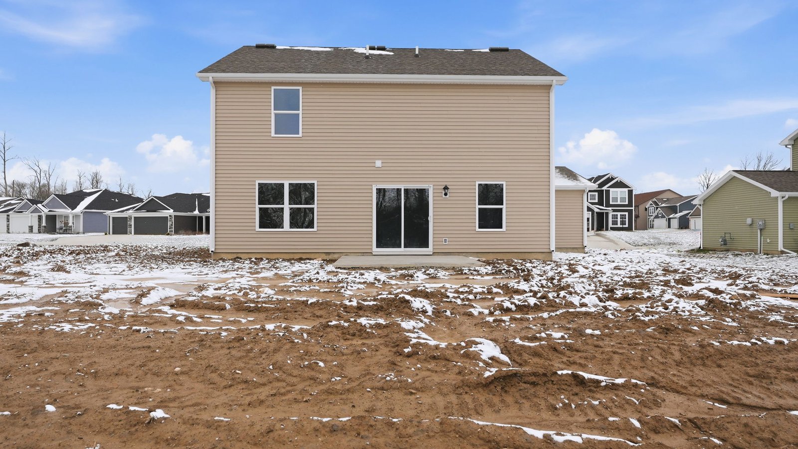 the haven bellamy rear exterior with patio, spacious backyard, and treelined yard