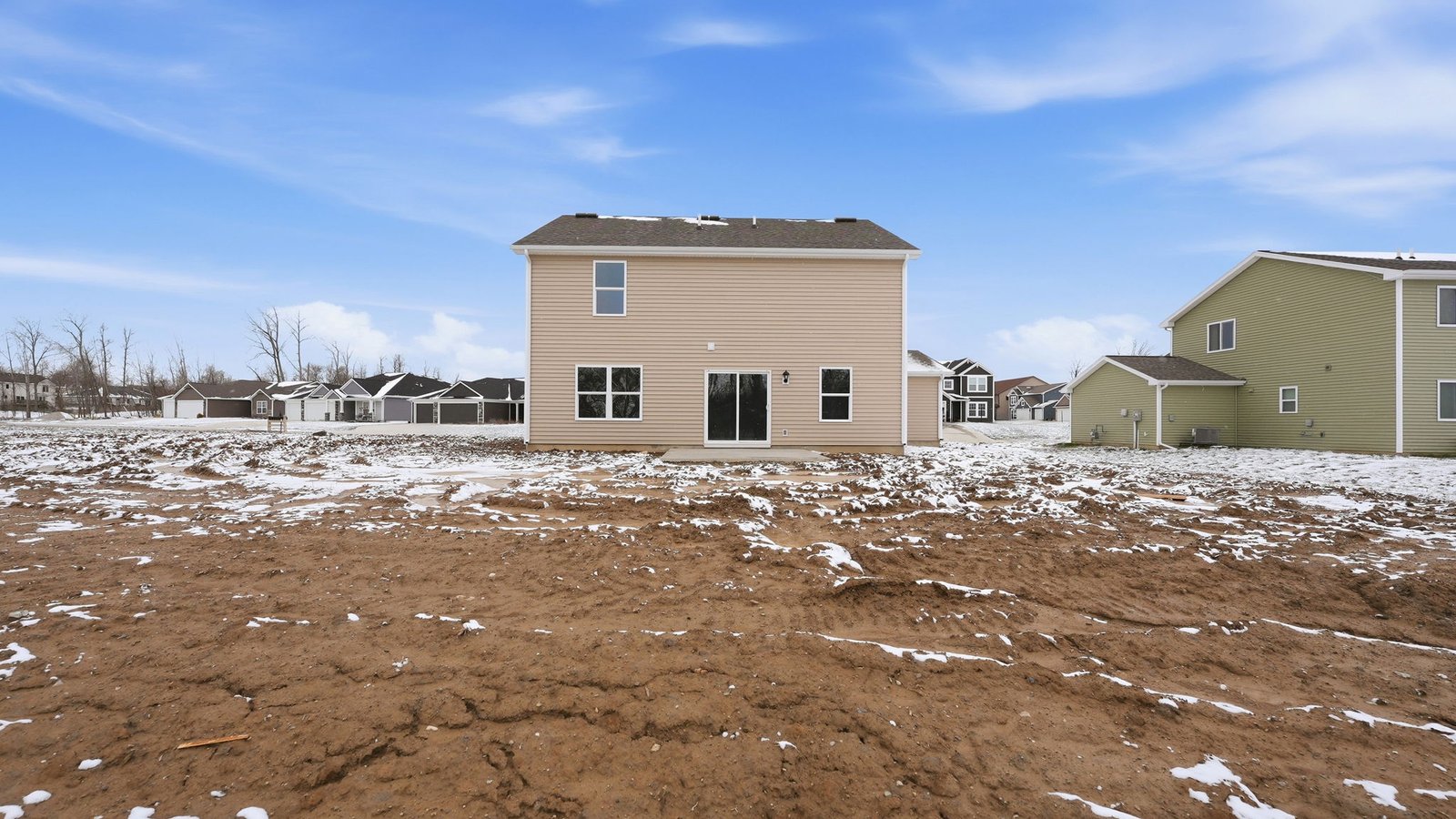 the haven bellamy rear exterior with patio, spacious backyard, and treelined yard