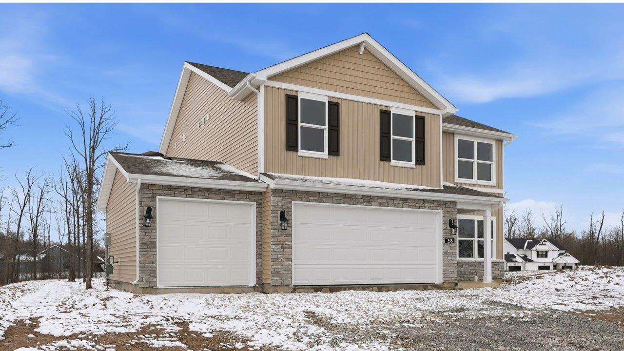 the haven bellamy exterior with 3 car garage and spacious yard