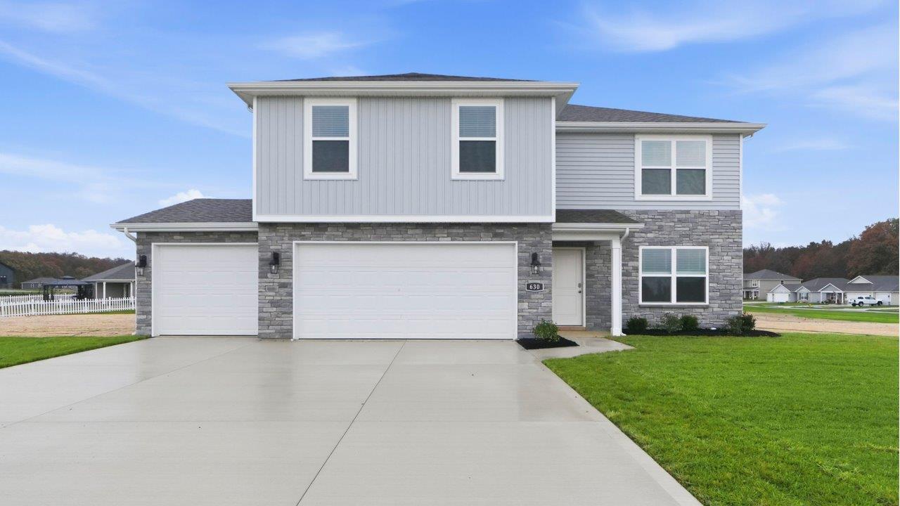 parlor bluffs spec home 2 story with 3 car garage and landscaping