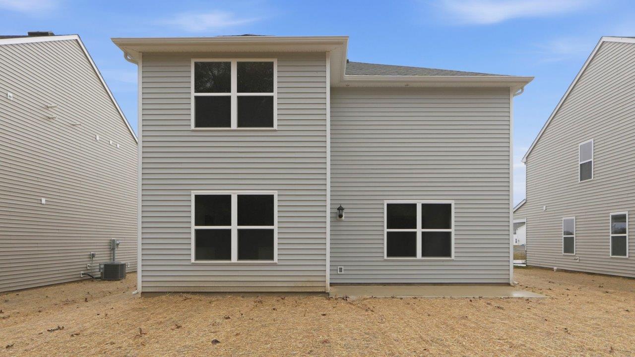 pine rear exterior with patio and tree view