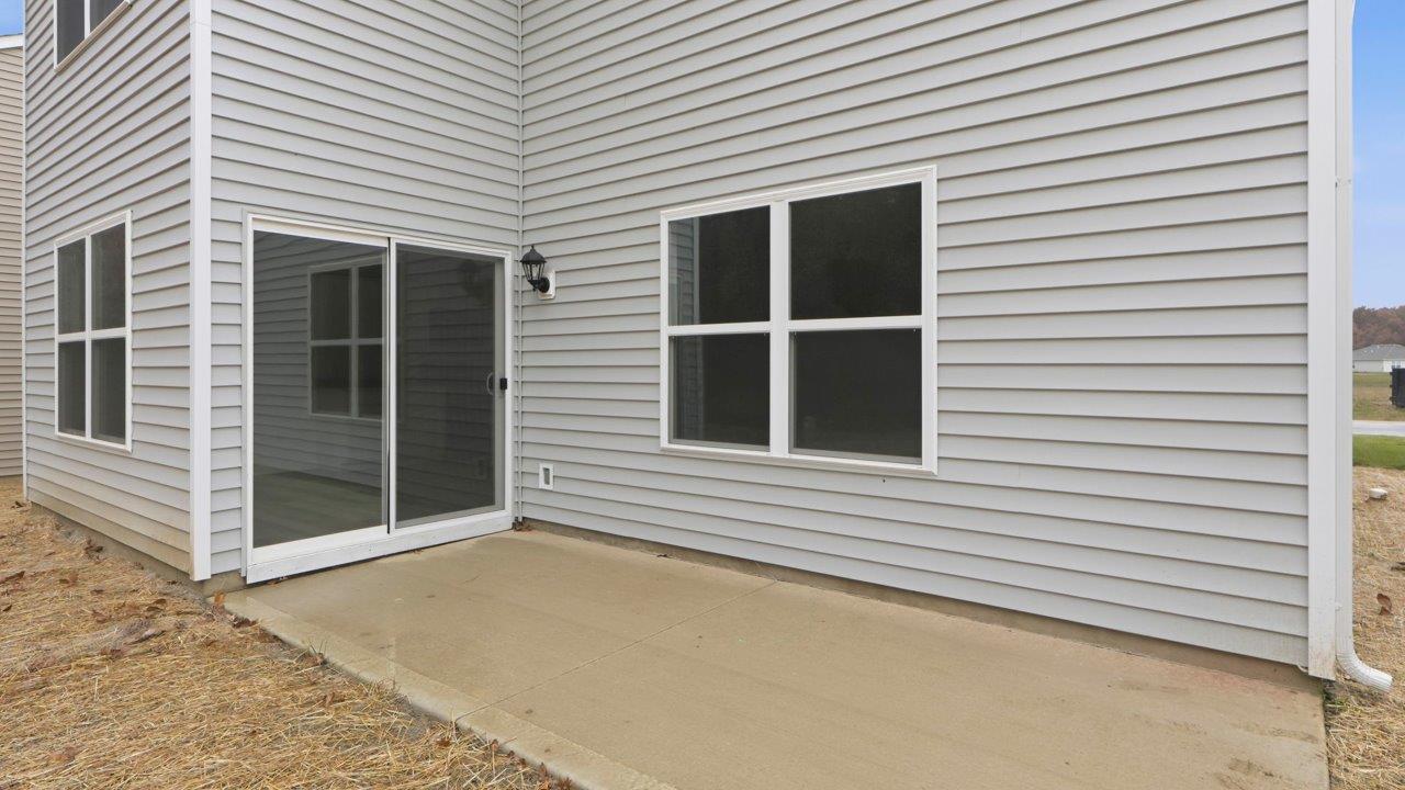 pine rear exterior with patio and tree view