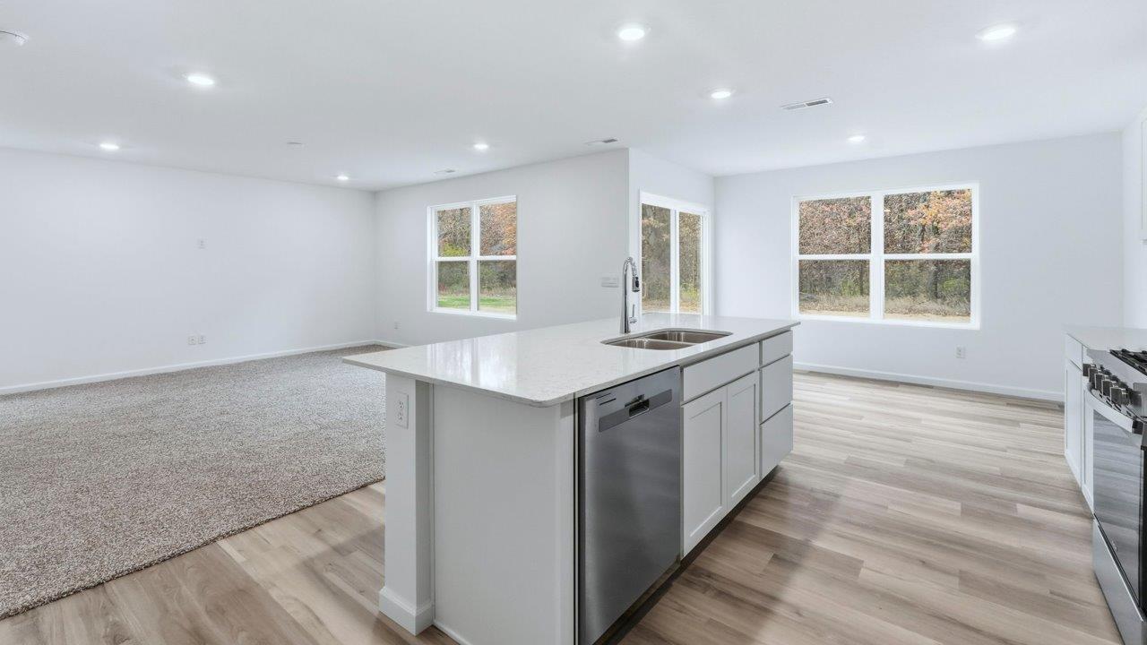 pine open layout kitchen, dining, and living rooms