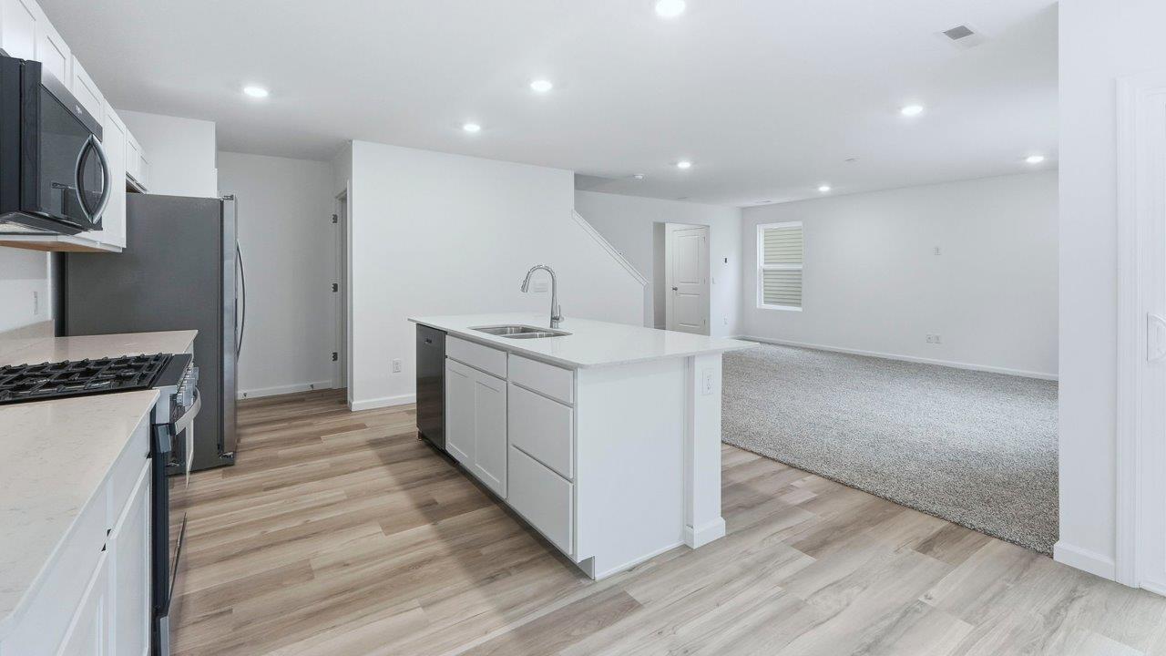 pine open layout kitchen, dining, and living rooms