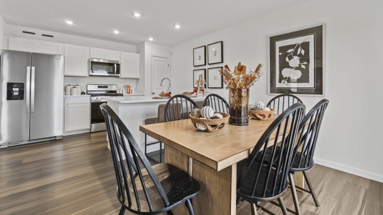 aldridge dining room with lvp and sliding door to backyard patio