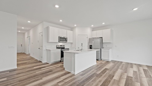 Kitchen with white cabinets and stainless steel applicances