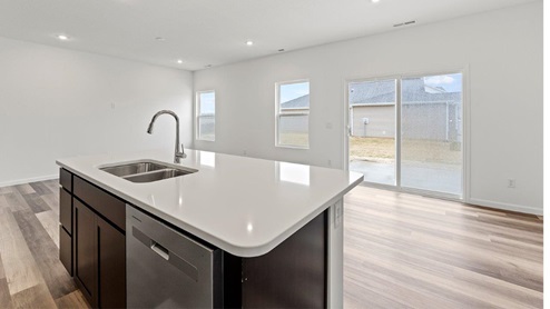 kitchen island overlooking dining and living room