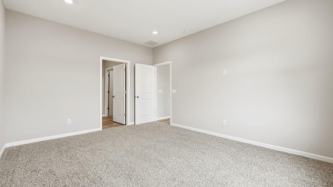 marcella chatham primary bedroom with ensuite bath and closet