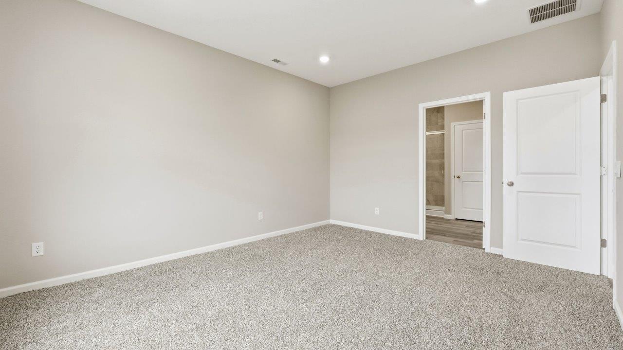 marcella chatham primary bedroom with ensuite bath and closet