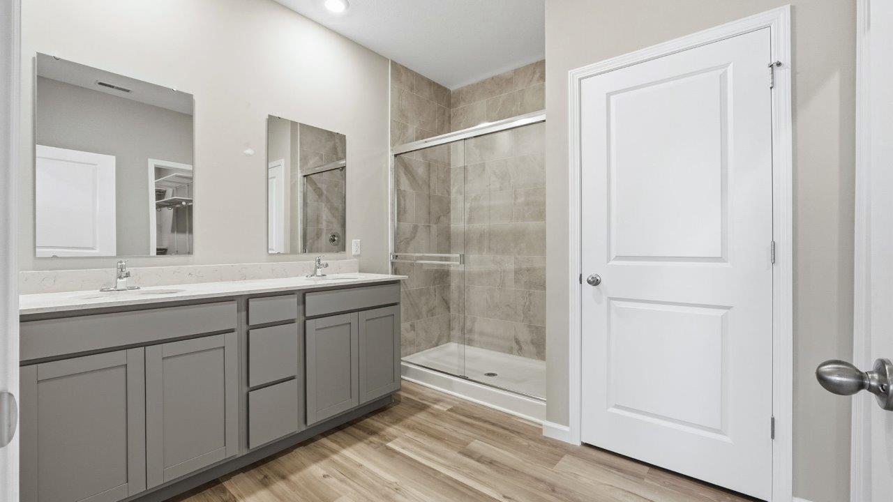 marcella chatham primary bedroom with ensuite bath and closet