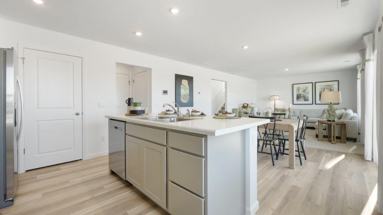 bellamy kitchen with stainless steel appliances, center island with bar seating