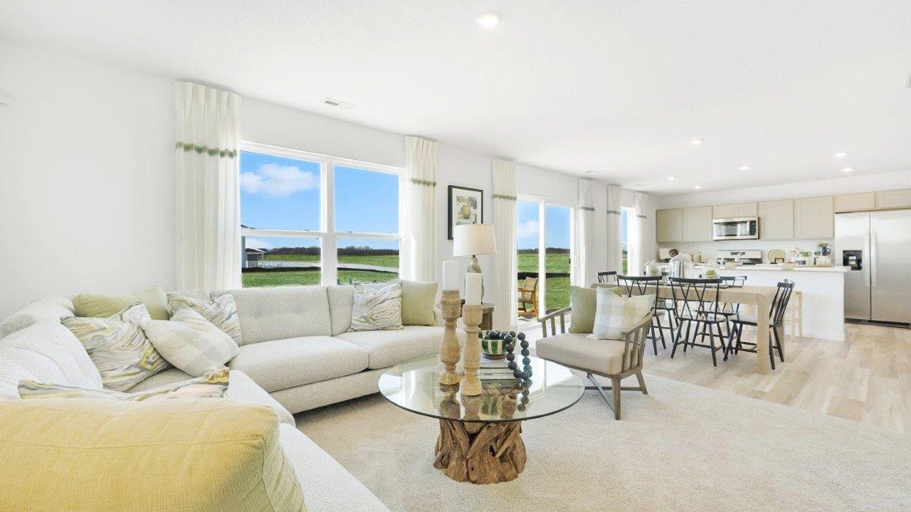 bellamy living room with carpet flooring, 2 windows, in open concept