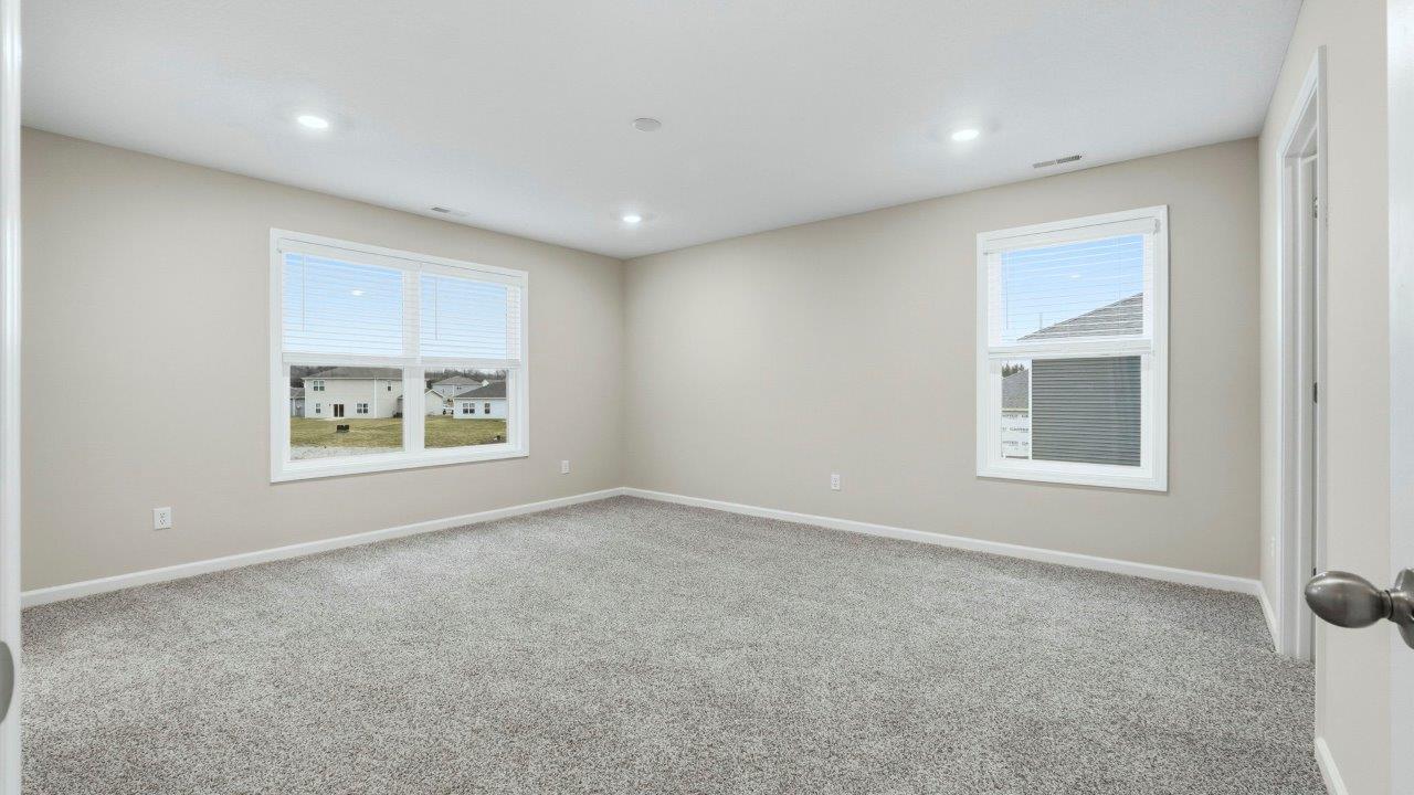 primary bedroom with ensuite bath and closet