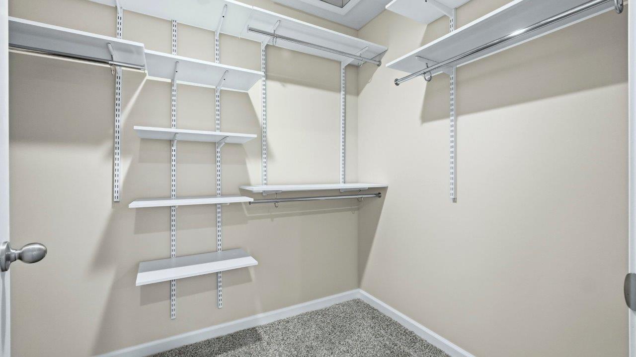 primary bedroom with ensuite bath and closet