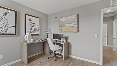 Estates at Signal Ridge Chatham model home bedroom two decorated as an office space