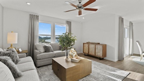 Estates at Signal Ridge Chatham model living room with 52" ceiling fan included