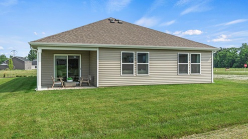 Estates at Signal Ridge Chatham model home backyard with 12x12 concrete covered patio and sodded yard