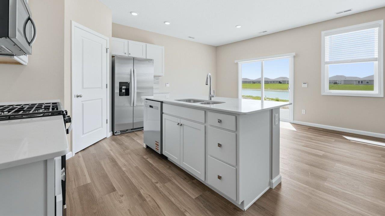 estates at signal ridge harmony villa kitchen island overlooking dining space