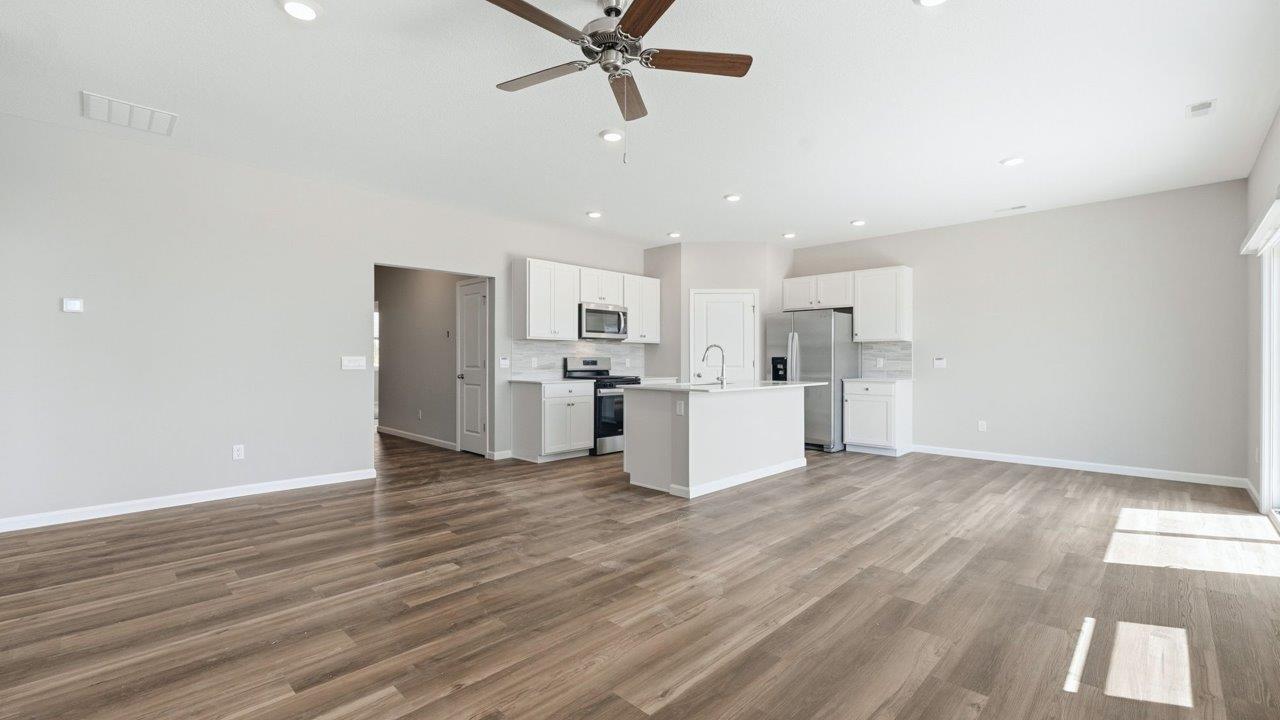estates at signal ridge harmony villa living room with lvp flooring and open layout