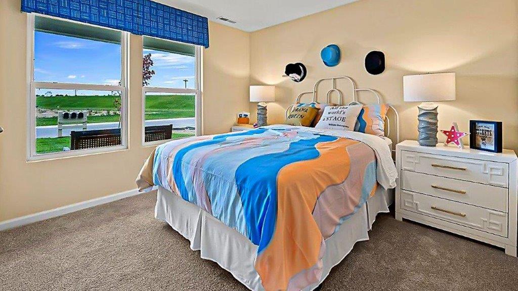 bedroom 4 with carpet, closet, and 2 windows