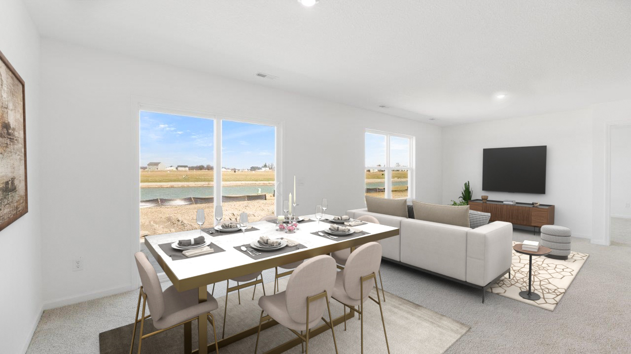 casual dining room with carpet flooring and sliding glass door to backyard patio