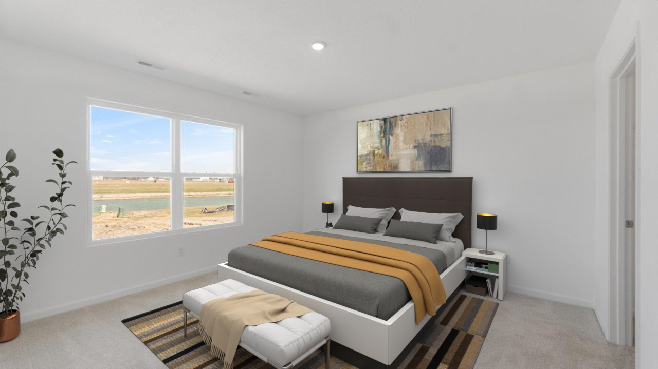 primary bedroom with 2 windows, white walls, carpet flooring, and ensuite bath and closet