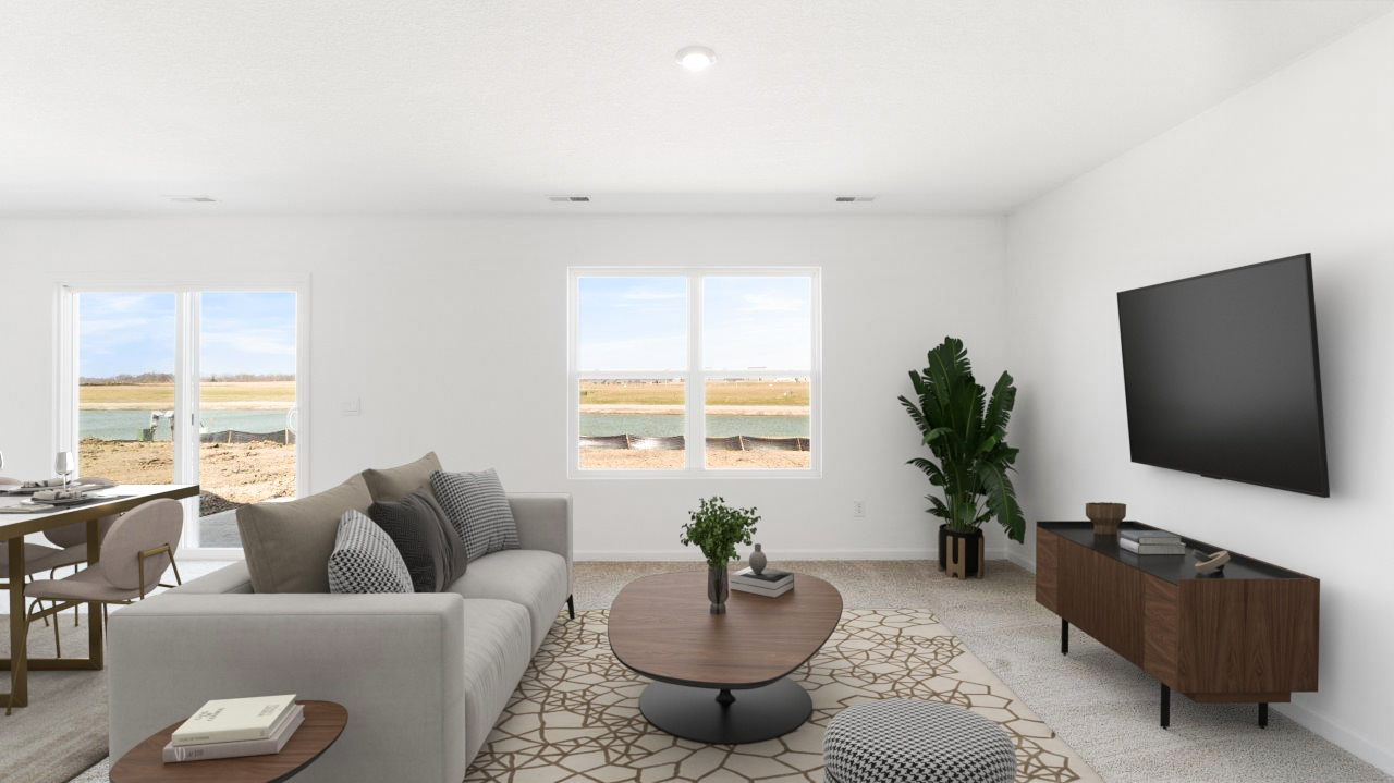 living room with carpet flooring, white walls, and 2 windows