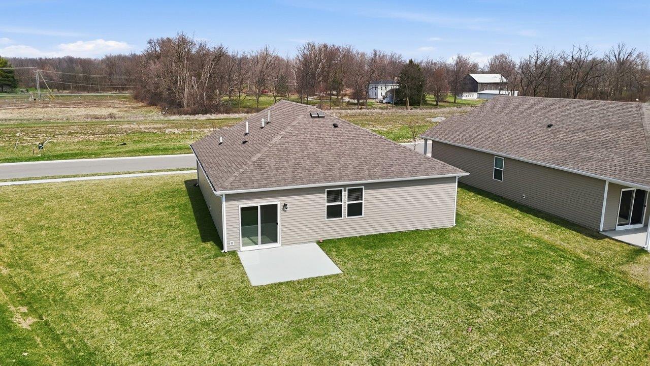 estates at signal ridge aldridge exterior with sod yard, landscaping, 2 car garage, and pond homesite