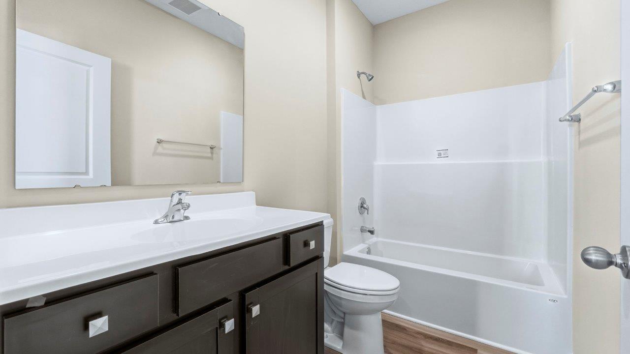 full bathroom with sink vanity and tub shower