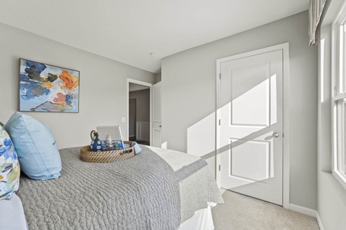Timber Creek Chatham Model Home - bedroom 2 with on suite closet space.