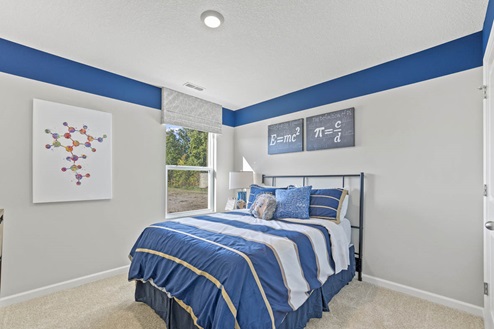 Timber Creek Chatham Model Home - Bedroom 3 with carpet flooring with single window.