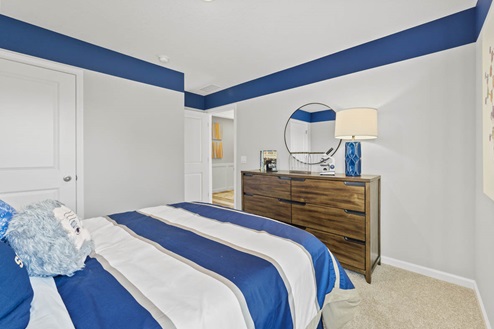 Timber Creek Chatham Model Home - Bedroom 3 with carpet flooring decorated as a child's bedroom.