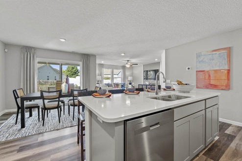 Timber Creek Chatham Model Home - kitchen island with Carrara Marmi Quartz countertops