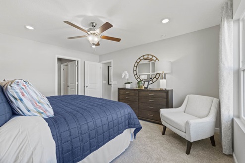 Timber Creek Chatham Model Home - Main Bedroom with carpet flooring.