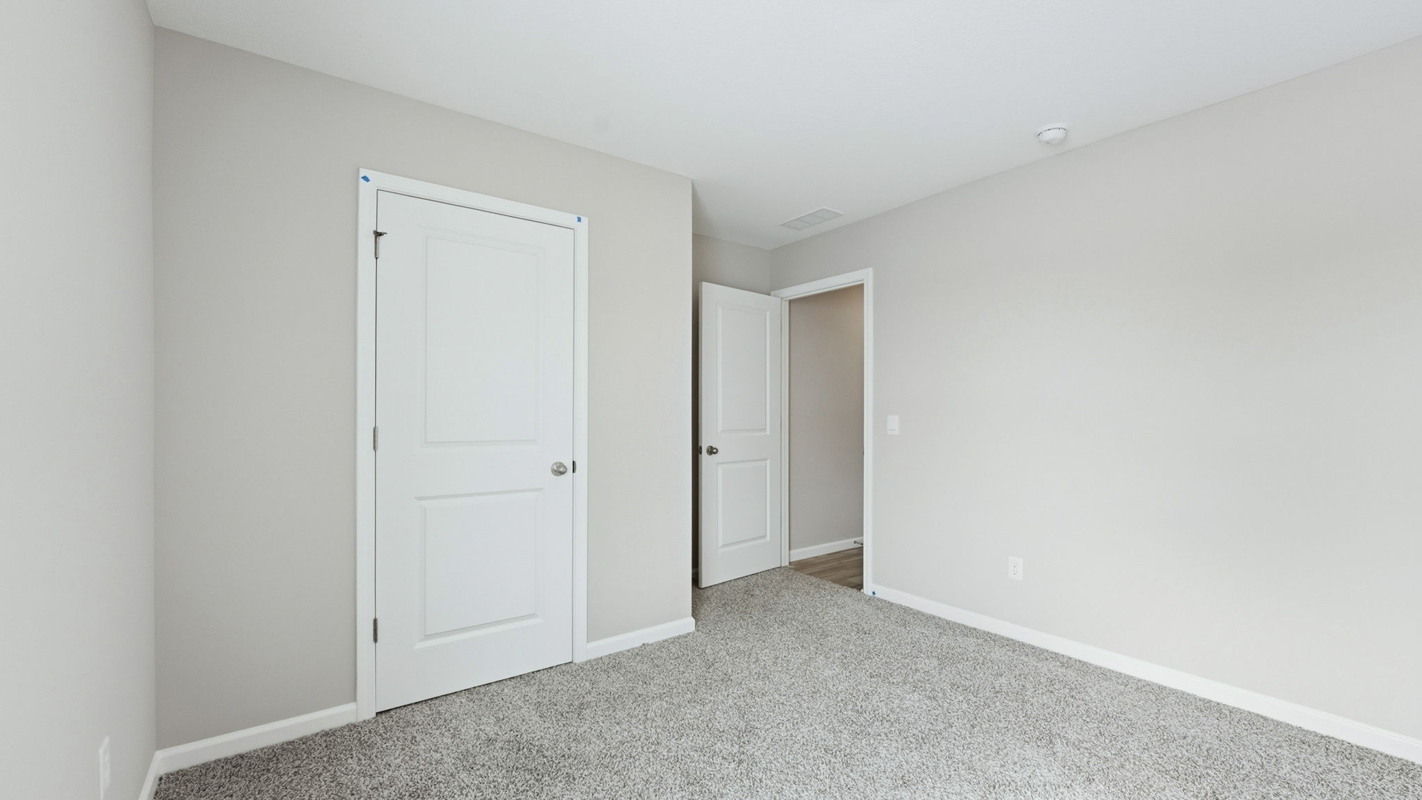 bedroom 4 with carpet, popular gray walls, and closet